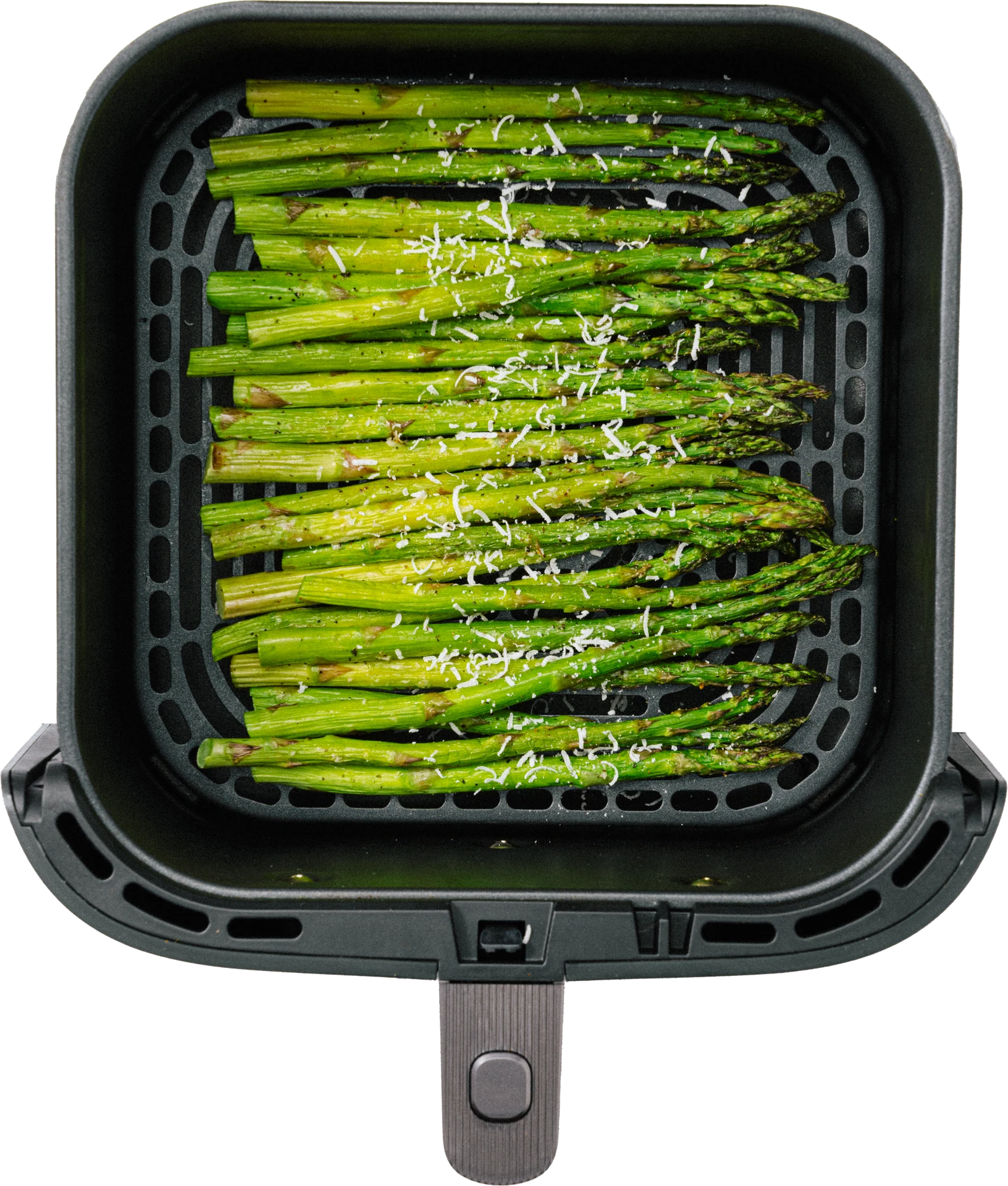 Freshly cooked asparagus spears topped with grated cheese, arranged in a black air fryer basket.