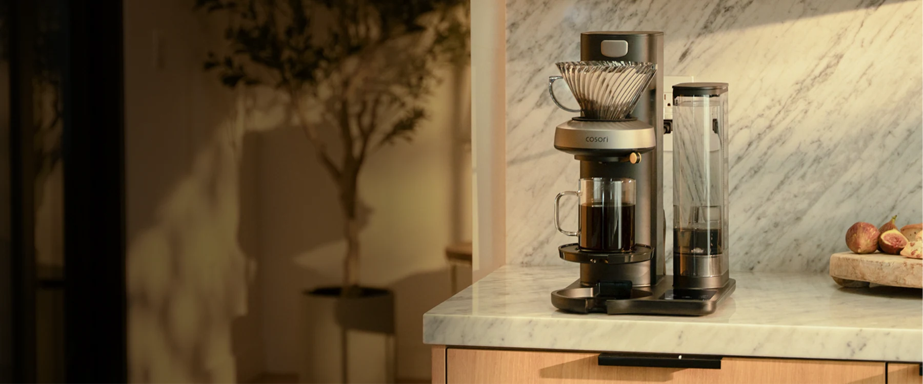 Juni pour-over coffee machine on a marble kitchen counter